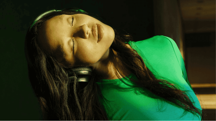 A woman dancing while wearing Bose Quietcomfort Headphones