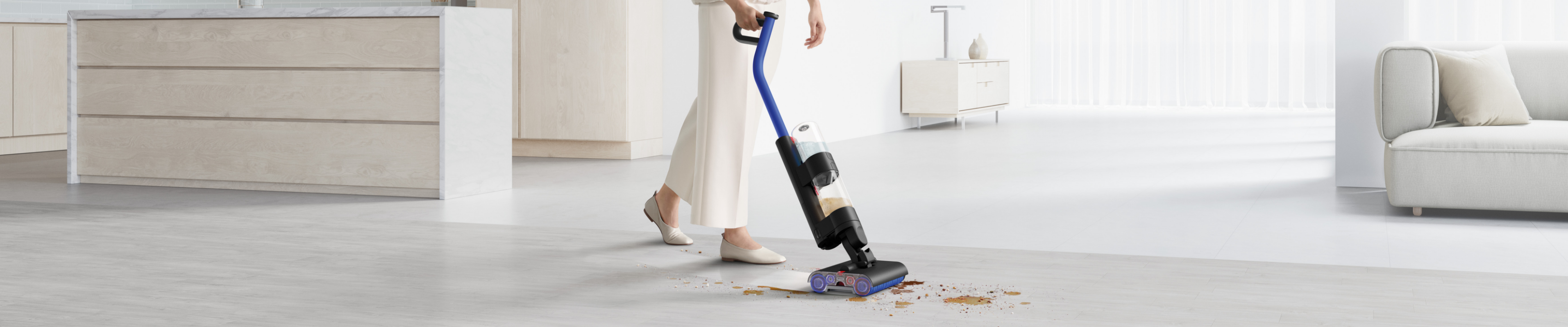 Dyson WashG1™ Wet Cleaner cleans dirty floor.