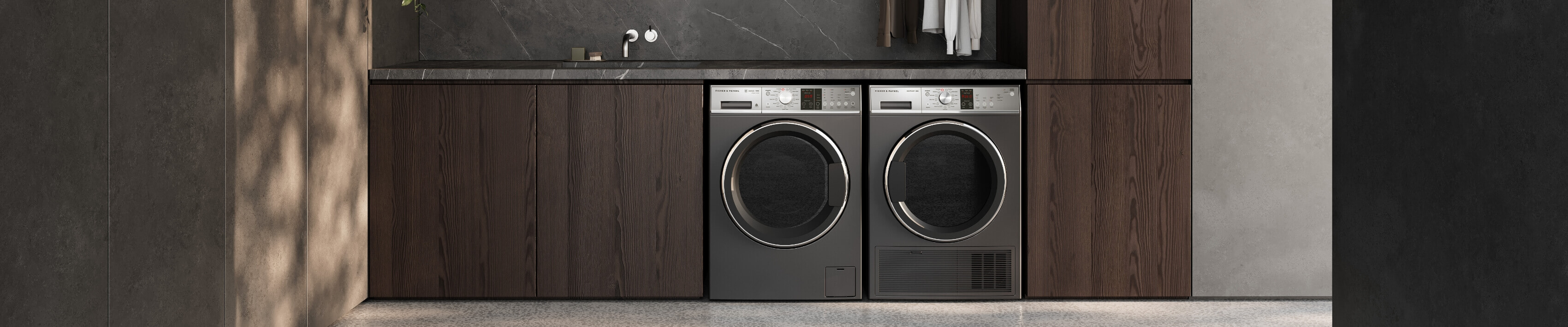 Stylish graphite coloured washer and dryer side by side in laundry.