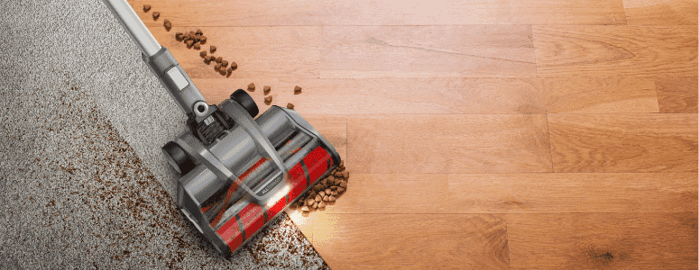 The Hoover ONEPWR Emerge vacuums spilled kibble on carpet and hardwood flooring.