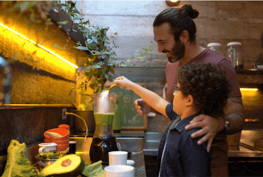 A father and son cooking dinner together