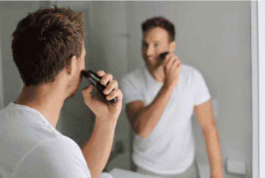 A man shaving in his bathroom