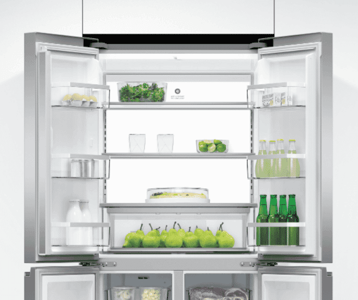 An open Quad Door Refrigerator in a pristine white kitchen