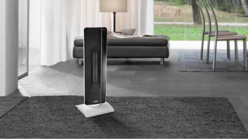 DeLonghi 2400W Electronic Ceramic Tower Heater in living room