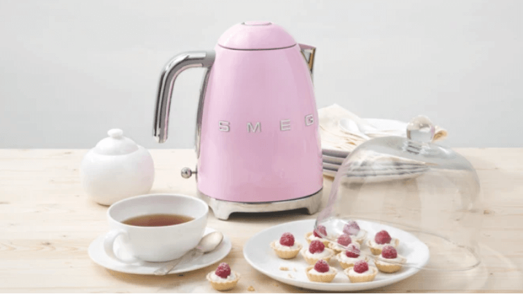 Pink smeg kettle in a modern kitchen