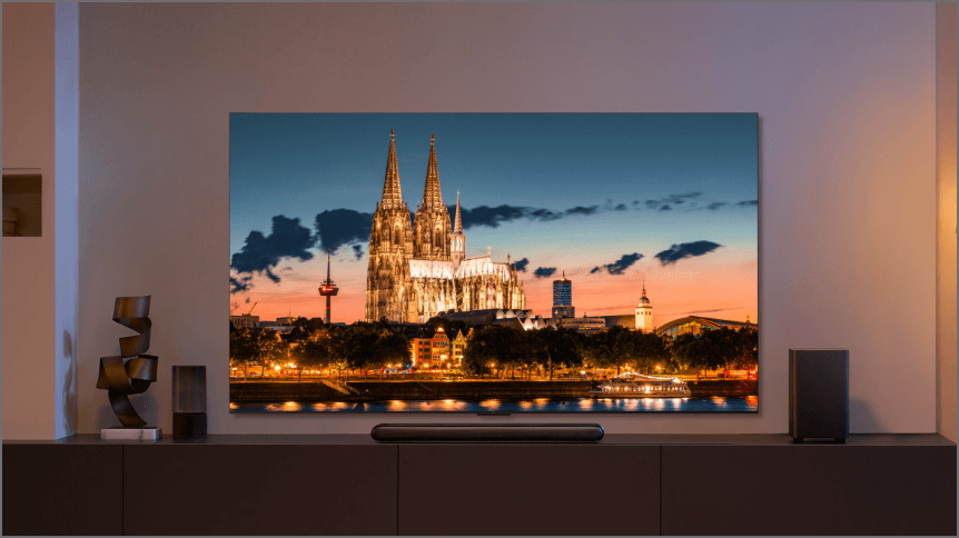 Image of the TCL 98 C855 QD-Mini LED Google TV in a modern living room.