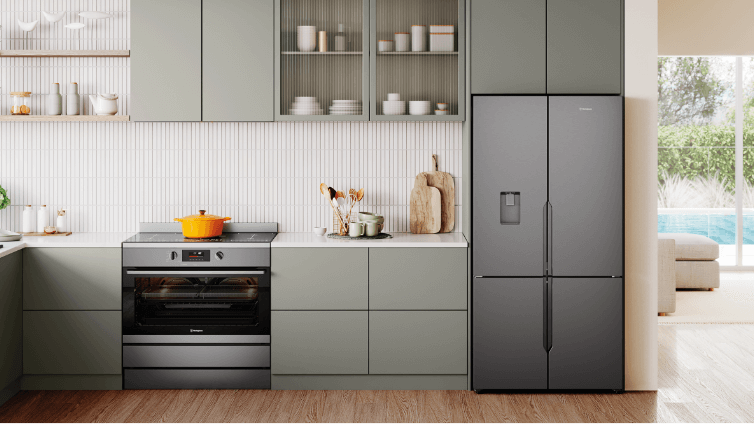 Lifestyle image of a modern kitchen featuring a Westinghouse quad door fridge.