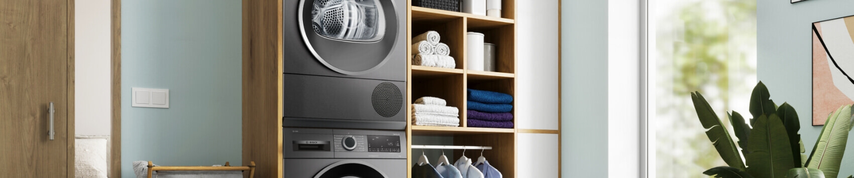 Stacked Bosch Graphite Washer and Dryer in laundry.