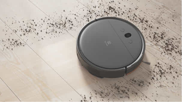 Electrolux vacuum cleaning dirt off hard wood floors.