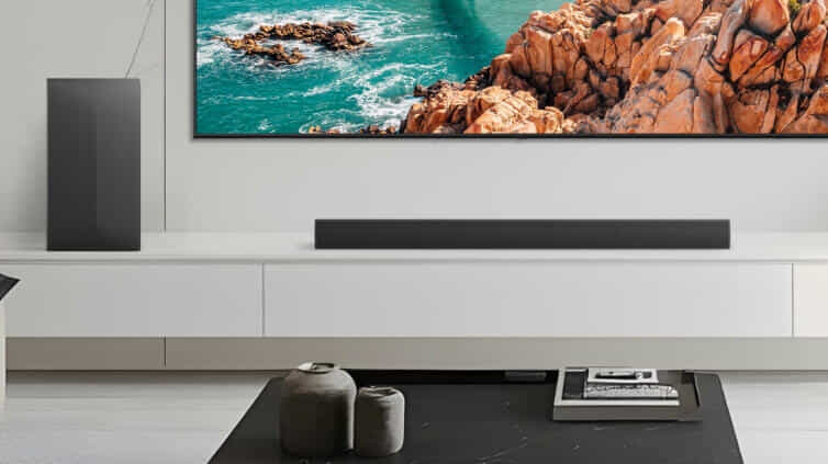 Close up of sleek LG soundbar underneath TV.