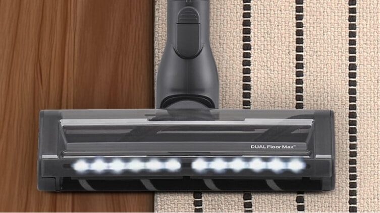 LG vacuum going over carpet and floorboard.