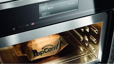 Popcorn cooking in Miele Microwave.