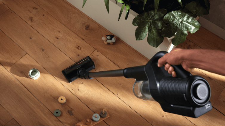 The Miele Duflex vacuuming floorboards