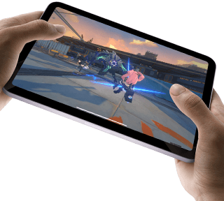 iPad mini held by a user's hands in landscape view playing a graphically intense game