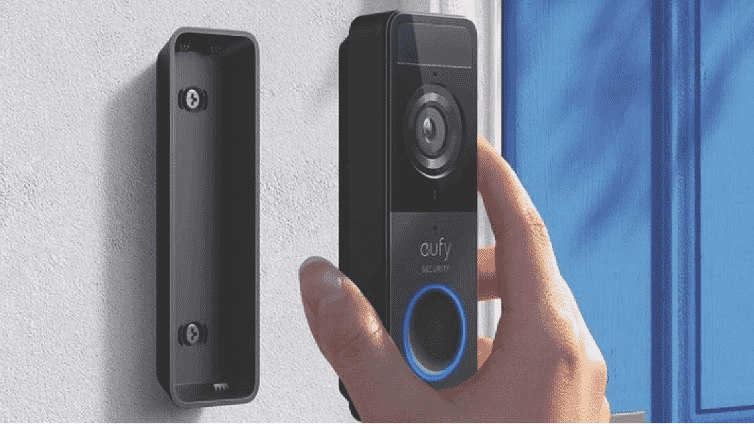 Close-up image of a hand holding a eufy Video Doorbell.