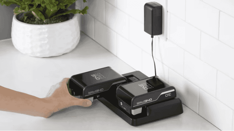 Hoover Onepwer Batteries charging on a modern benchtop