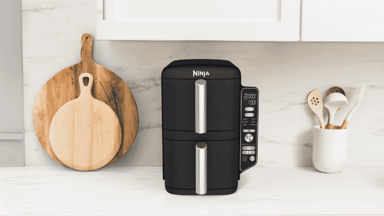 Lifestyle image of the Ninja® DoubleStack™ XXXL 2 Drawer Air Fryer on a kitchen bench.