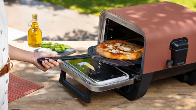 Cook a pizza to perfection with Ninja's outdoor woodfire oven.