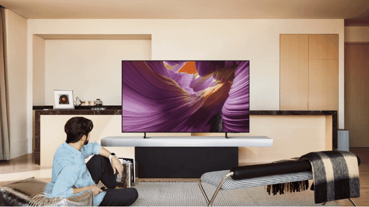 Man watching Samsung 2025 TV.