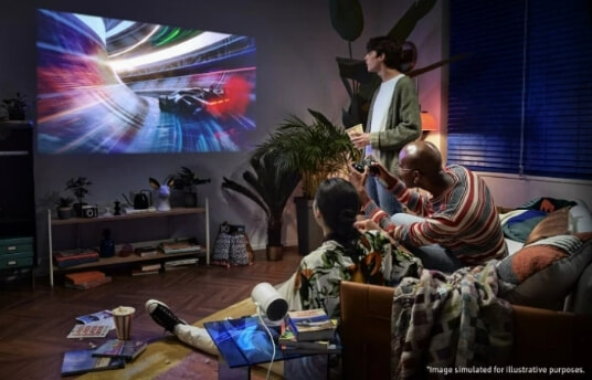 Kids watching Samsung projector on wall.