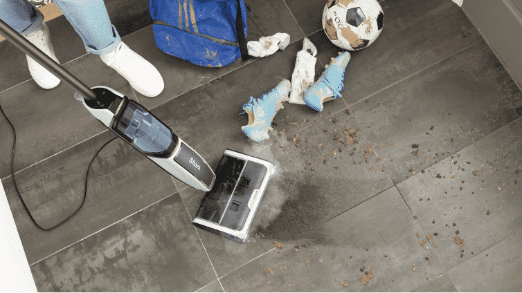Shark Steam Pickup™ 3-in-1 Steam Mop vacuuming debris
