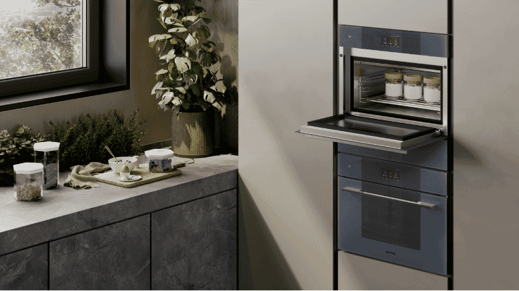 Close up of two smeg ovens on a wall.
