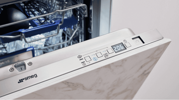 Close up of open built in smeg dishwasher.