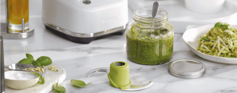 Image of Breville food processor S Blade with a jar of prepared pesto next to it on a benchtop.