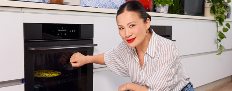 Image of Poh Ling Yeow using the knock knock feature on an LG Oven