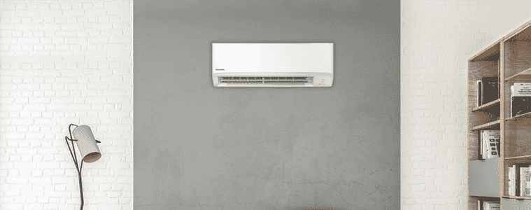 A Panasonic split system air conditioner in a living room.