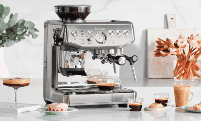 Breville Barista Express Impress Coffee Machine in white modern kitchen with espresso's. 
