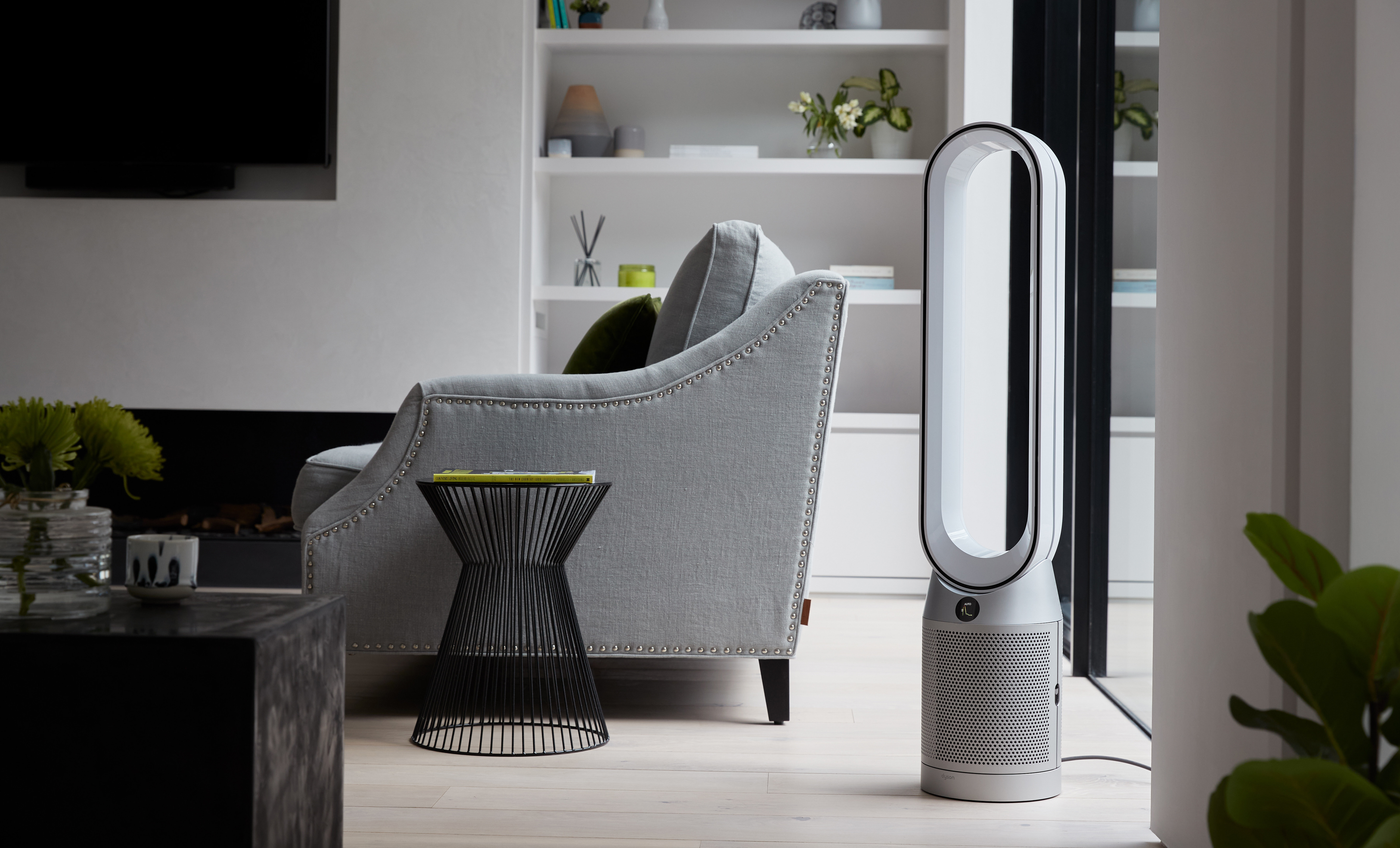 A Dyson air purifier purifies a modern living room.