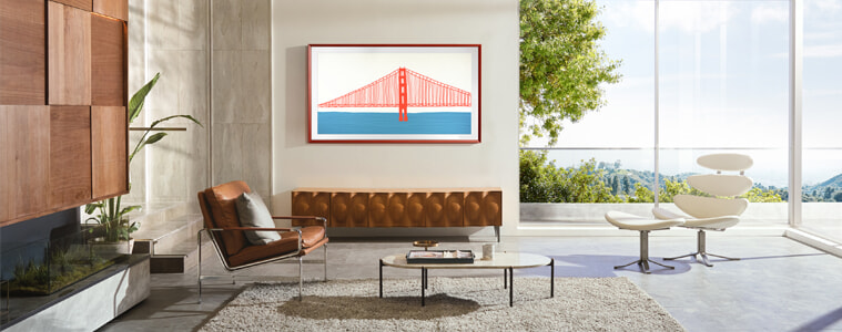 A lifestyle TV displays artwork of a bridge in a sleek, modern living room.