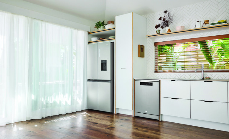 The Haier Dishwasher Satina matches a Haier fridge in a white kitchen.