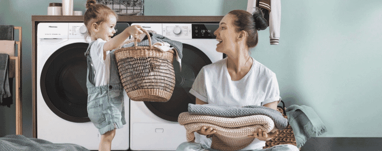 Mother and daughter doing laundry with the Hisense Washer and Dryer. 