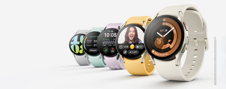 The Samsung Galaxy Watch6 is lined up with the different coloured watch bands. From left to right: White, mint, lavender, yellow, and beige.