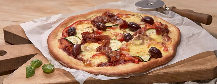 Prosciutto pizza on a table 