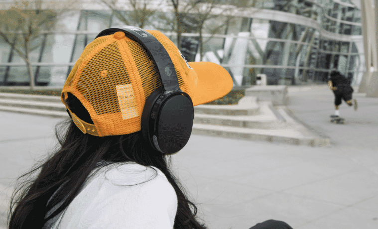 Woman wears Skullcandy Hesh Evo Headphones