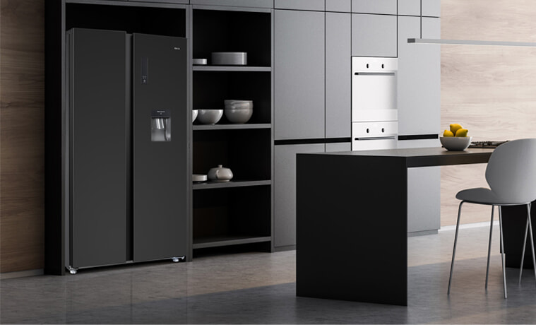 A black CHiQ fridge in a sleek modern kitchen.