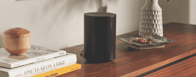 A portable Sonos speaker sits on a console.