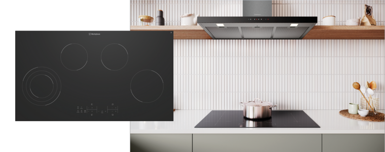 A Westinghouse cooktop in a white and sage green kitchen.