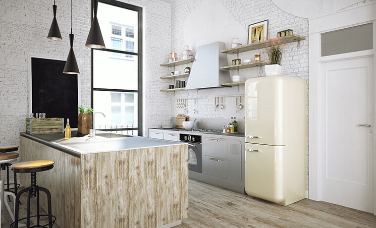 Retro style cream coloured fridge in a modern industrial style kitchen.
