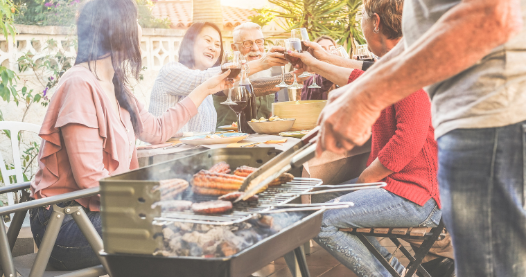 Family enjoying a barbecue outdoors.