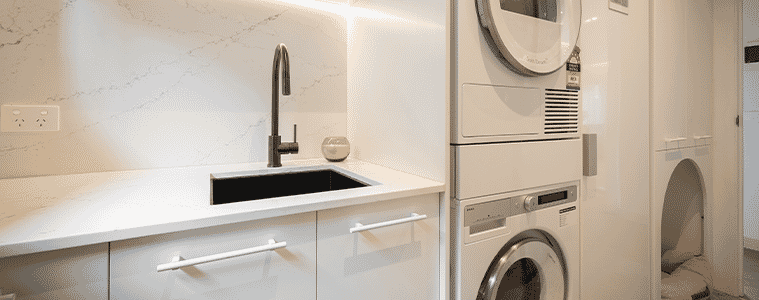 Modern ASKO Laundry featuring ASKO Heat Pump Dryer and Front Load Washing Machine 