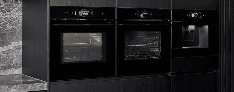 A modern kitchen featuring dual bosch series 8 ovens 