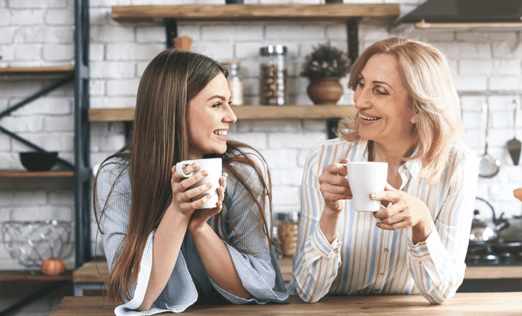 Mother and daughter enjoying coffee