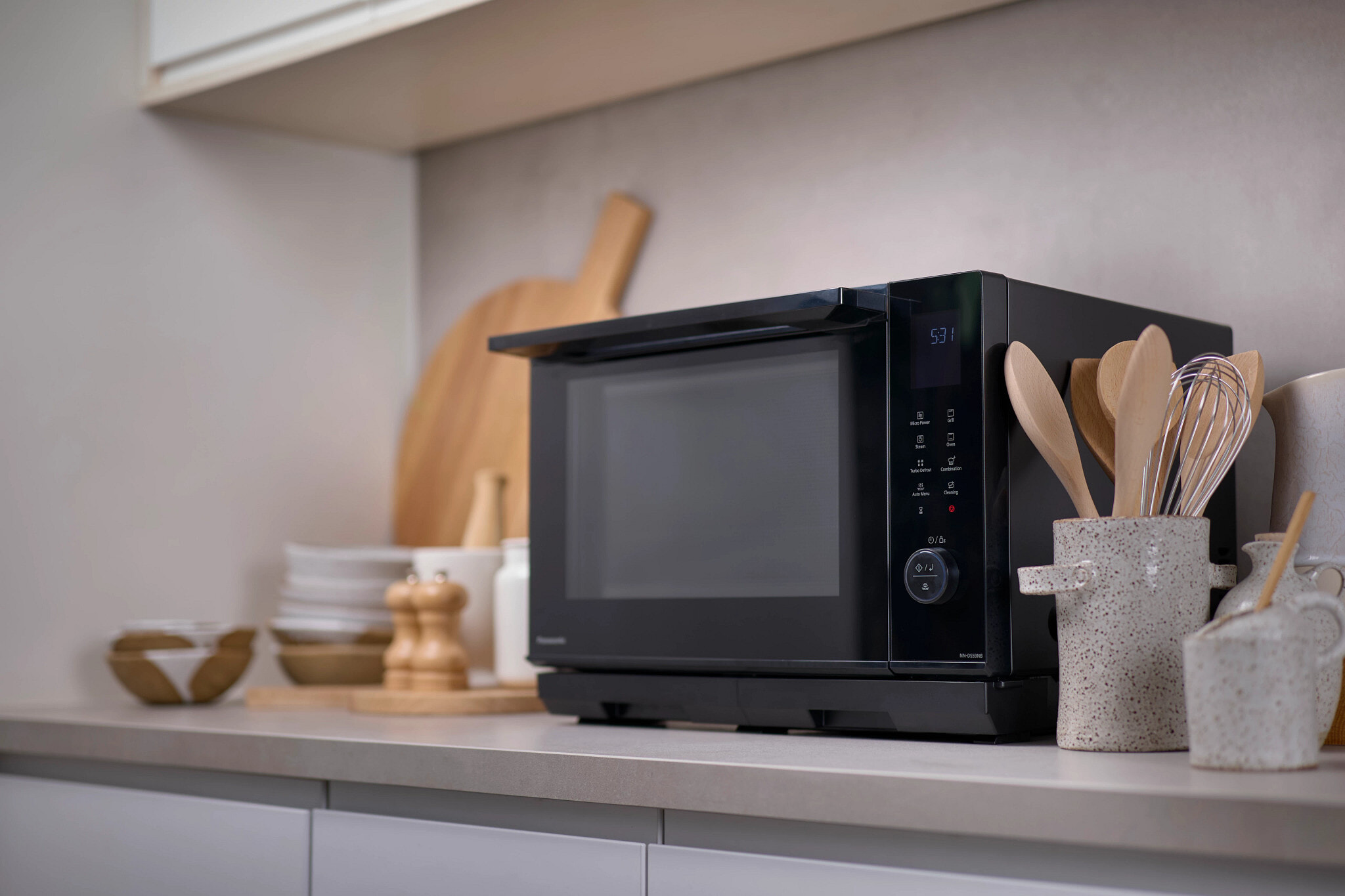 Shiny new Panasonic convection oven sits on a modern kitchen benchtop.