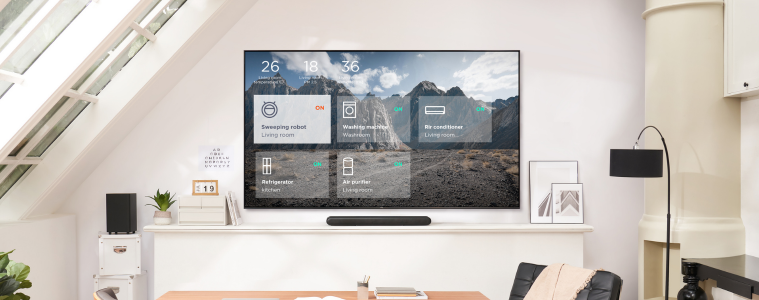 TCL C885 TCL TV in a modern office with wall mount and sounbar