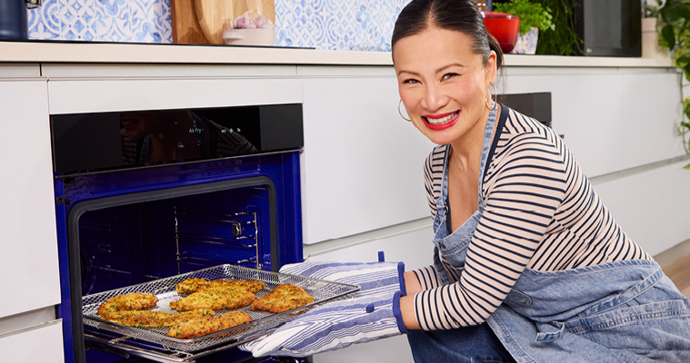 Image of Poh Ling Yeow putting her Parmesan & Herb Panko Parma dish in an LG Oven