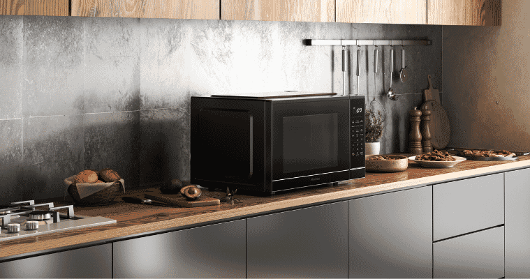 Lifestyle image of Hisense Microwave on a kitchen bench.